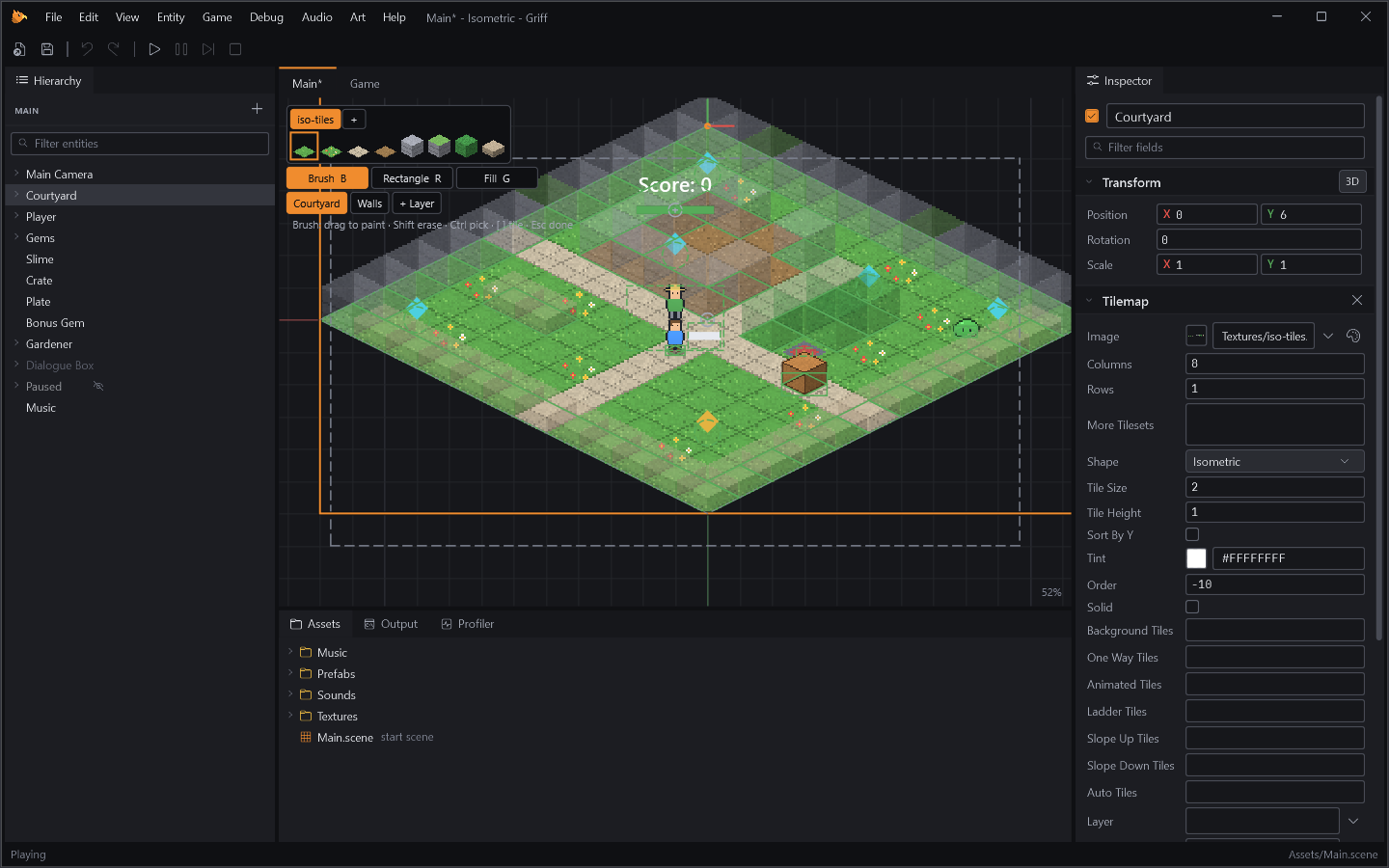 Painting the Isometric template's courtyard: the tile palette, brush, rectangle and fill tools over the Scene view.